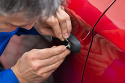 Locksmith unlocks car key lock